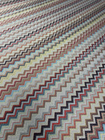 Colorful zigzag pattern metallic fabric with shimmering gold lurex stripes and 4-way stretch polyester blend