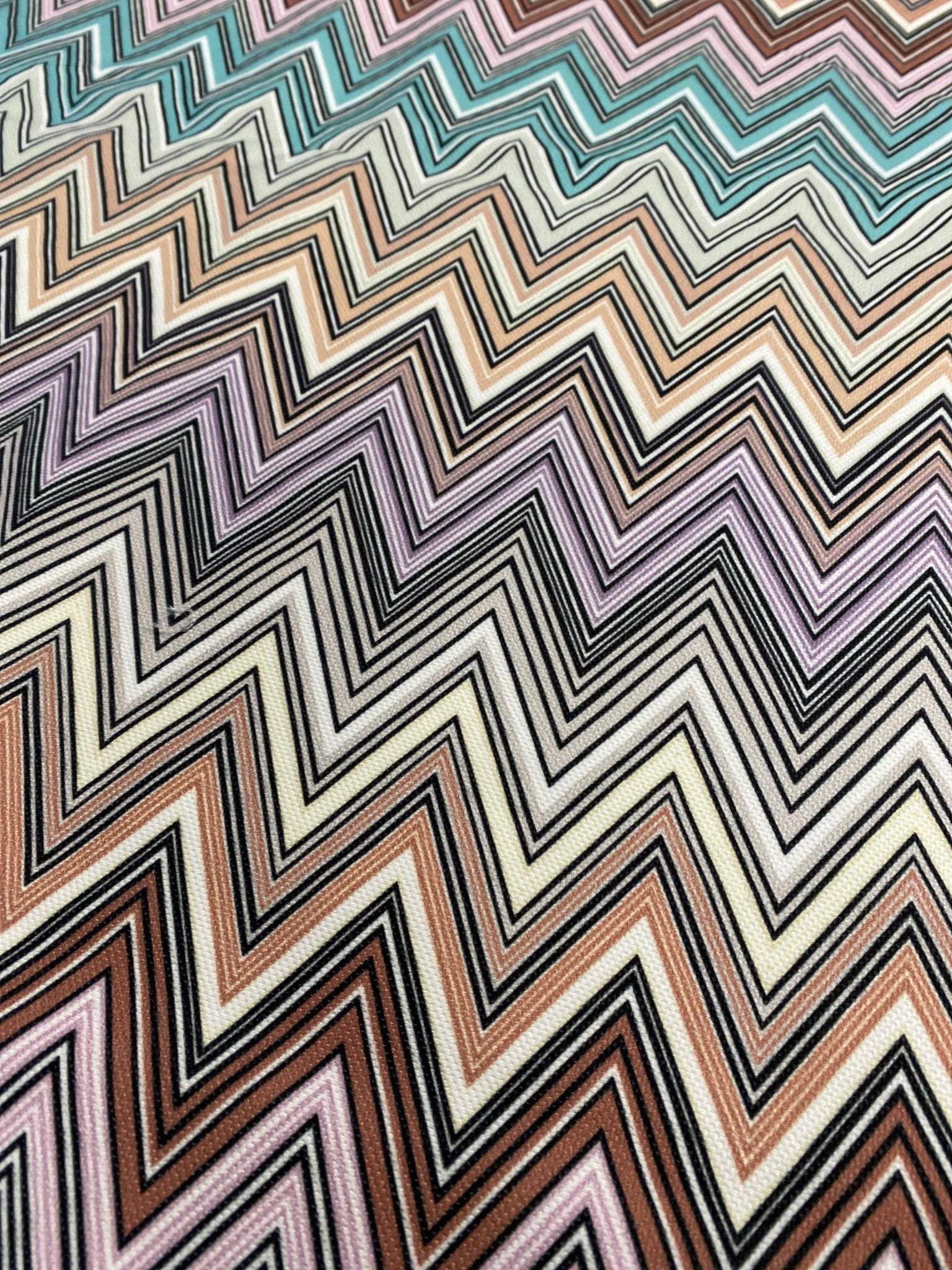 Colorful zigzag upholstery fabric with vibrant chevron pattern for creative home décor and furniture projects