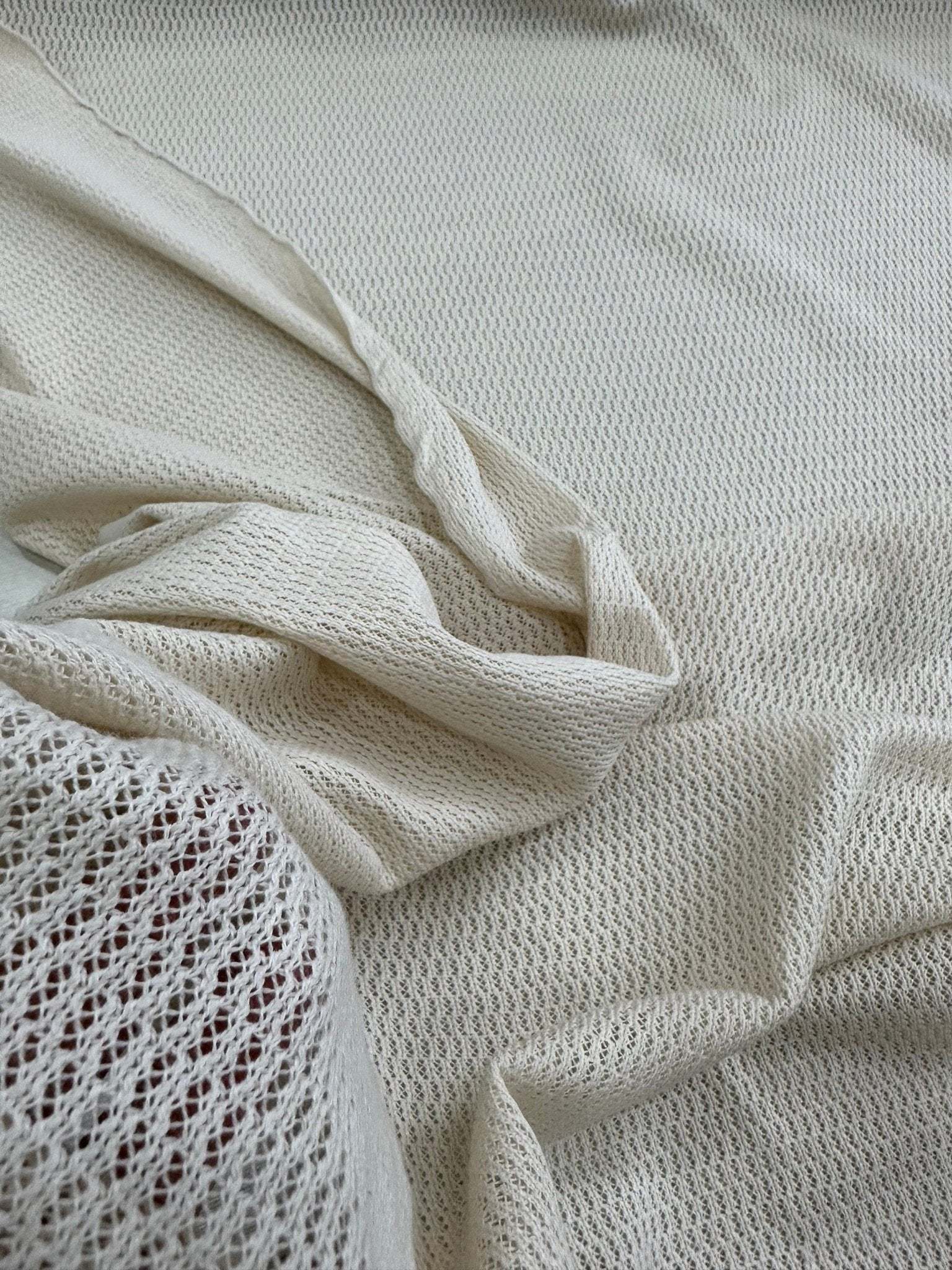 100 cotton off-white fishnet mesh fabric for crafting and apparel with breathable open weave texture