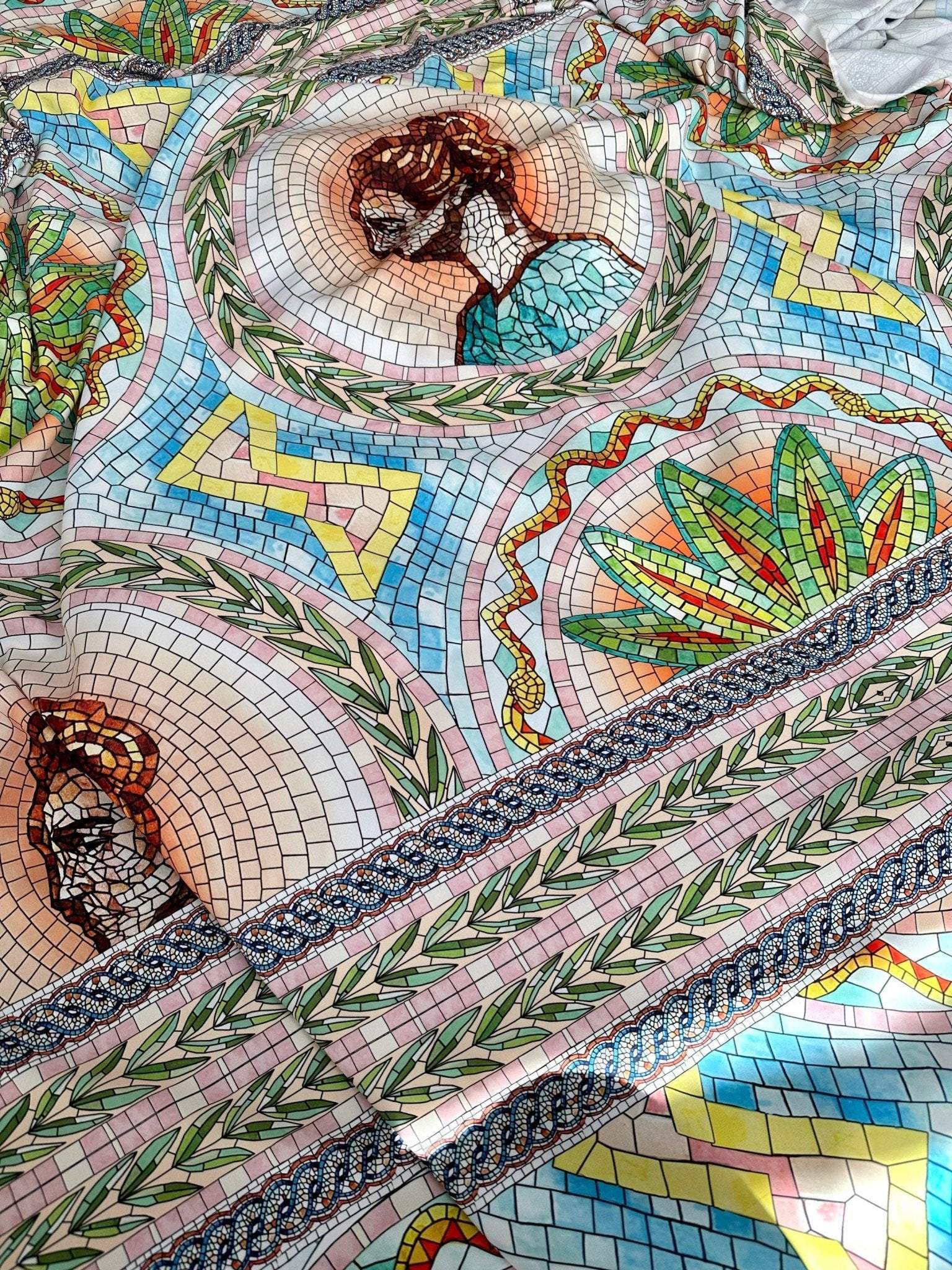 Greek Mosaic Print silky crepe fabric with intricate mosaic patterns and classical portrait designs in vibrant colors