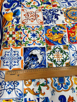 Colorful Sicilian print silky crepe fabric with intricate tile patterns and a ruler for scale