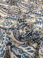 Cream background paisley print fabric with blue and gold intricate design details