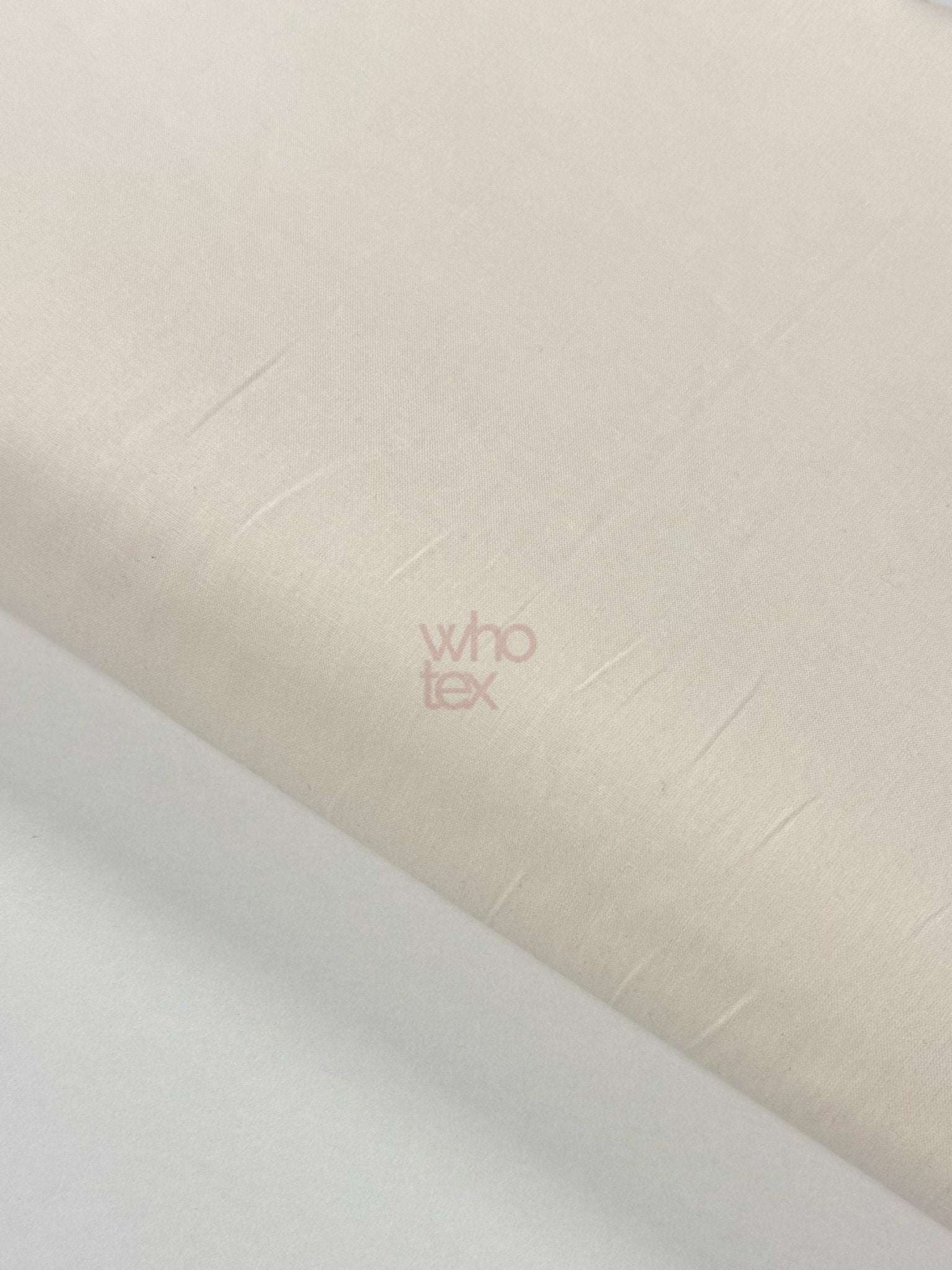 Cream ecru poplin fabric made of 100% cotton with 240 cm width, ideal for bedding and clothing.