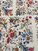 Cream floral botanical print fabric with colorful flowers on a cream background, ideal for sewing and home decor projects