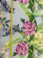 Tropical parrot print crepe fabric with vibrant floral and leafy design measuring 150cm wide