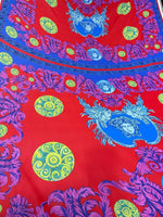 Purple swirl crepe fabric with vibrant intricate patterns and decorative designs