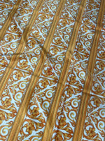 Elegant gold Baroque fabric with floral and scroll patterns in vertical stripes on white background