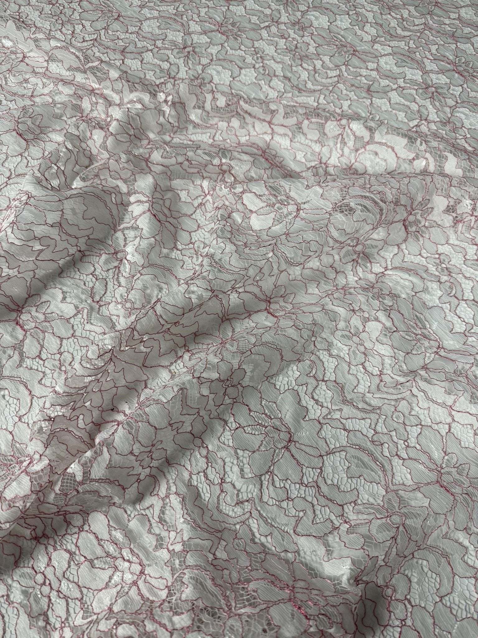 White and pink elegant lace embroidered fabric with floral design for sewing and crafting projects