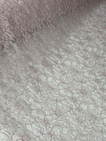 Elegant white and pink lace embroidered fabric with floral pattern for sewing and crafting projects