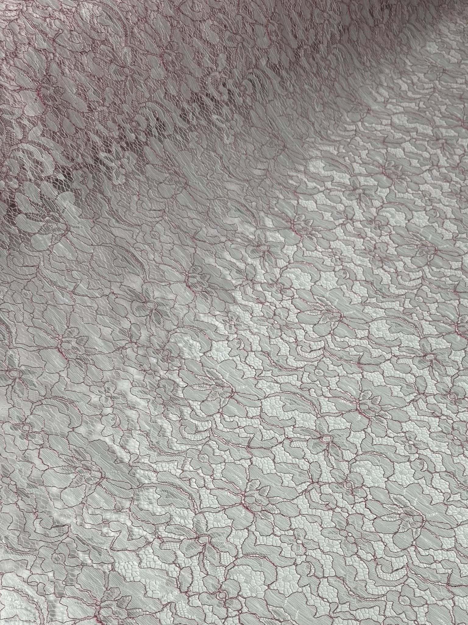 Elegant white and pink lace embroidered fabric with floral pattern for sewing and crafting projects