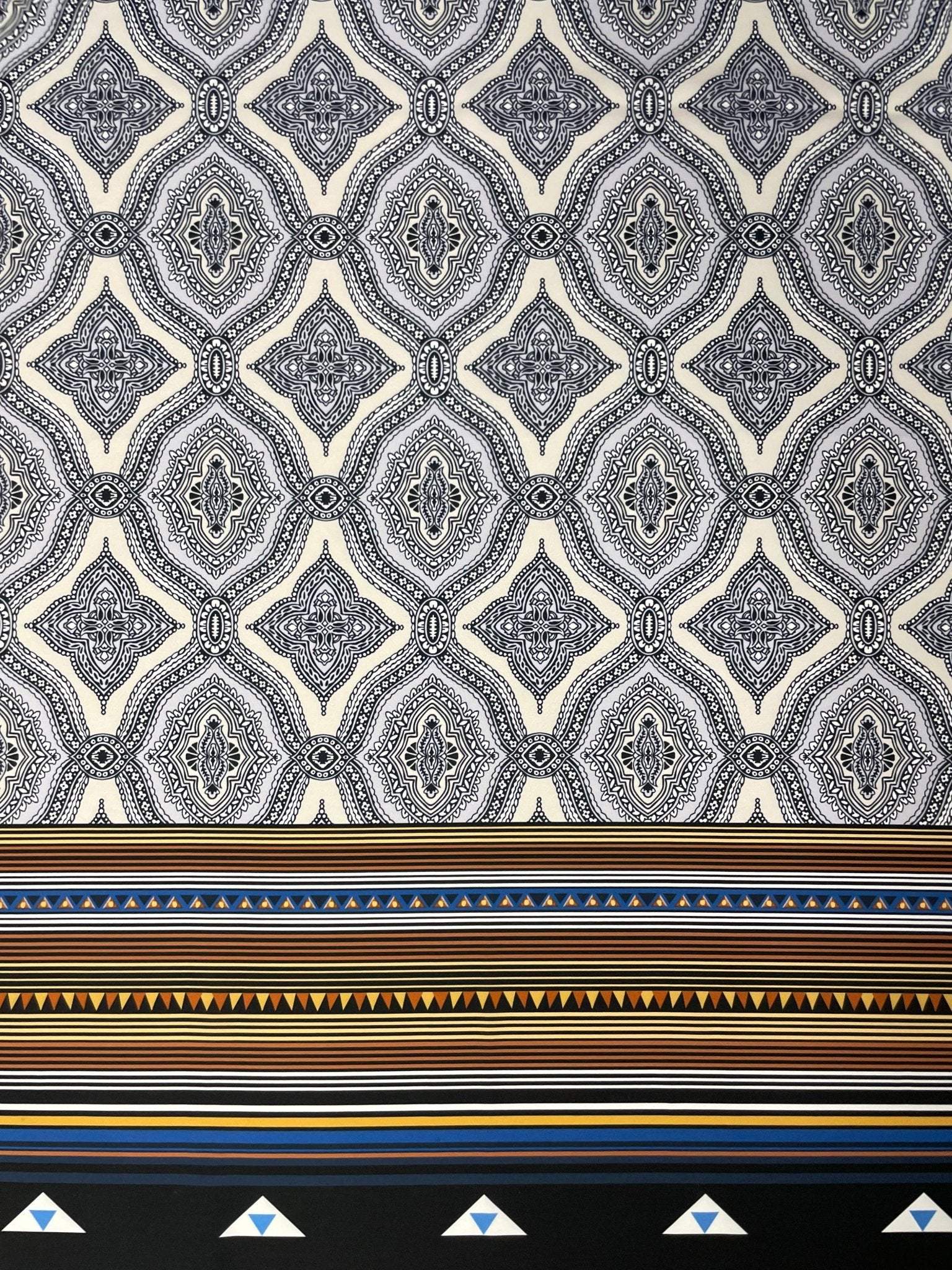 Black and white mandala pattern fabric with ethnic geometric striped border and tribal design elements