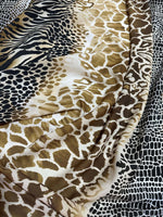 Exotic animal print fabric with giraffe, zebra, and leopard patterns in neutral tones and soft texture