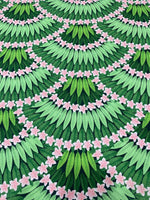 Floral leaf pattern crepe fabric with green leaves and pink flowers design