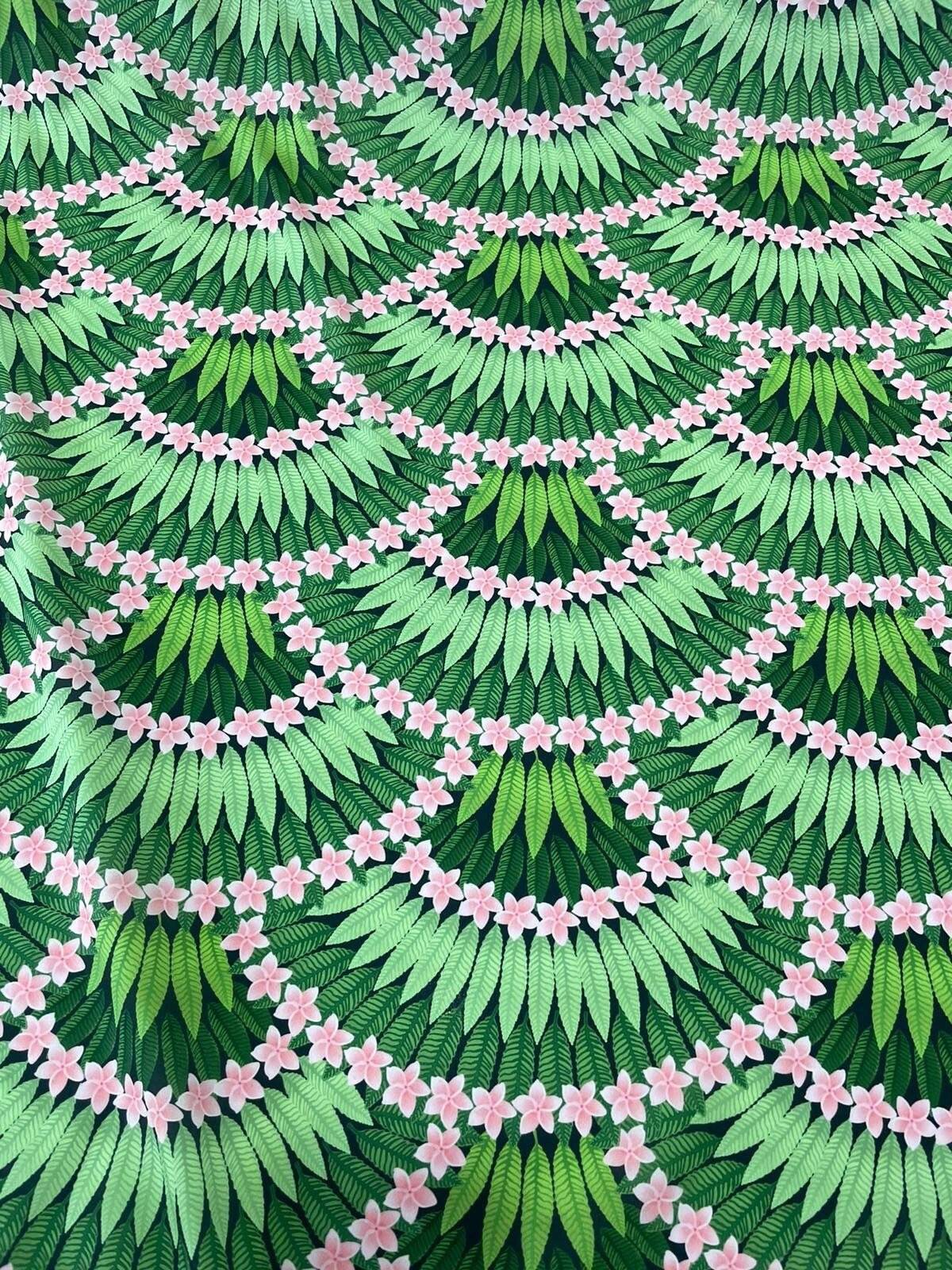 Green floral leaf pattern crepe fabric with pink flower accents and layered leaf design