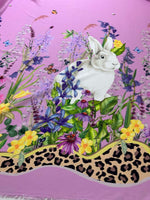 Pink fabric with rabbit print and colorful floral pattern