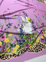 Pink rabbit print fabric with colorful flowers and leopard print border