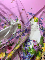 Pink rabbit print fabric with colorful flowers and butterflies pattern