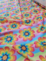 Colorful rainbow floral fabric with vibrant flower patterns and 150cm width for sewing projects