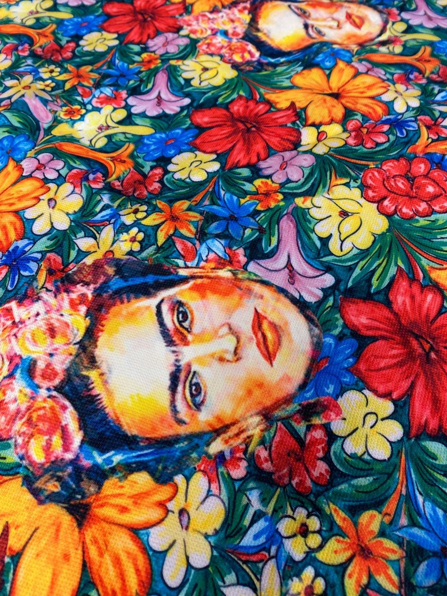 Frida Kahlo floral upholstery fabric with vibrant colorful flowers and artistic portrait design