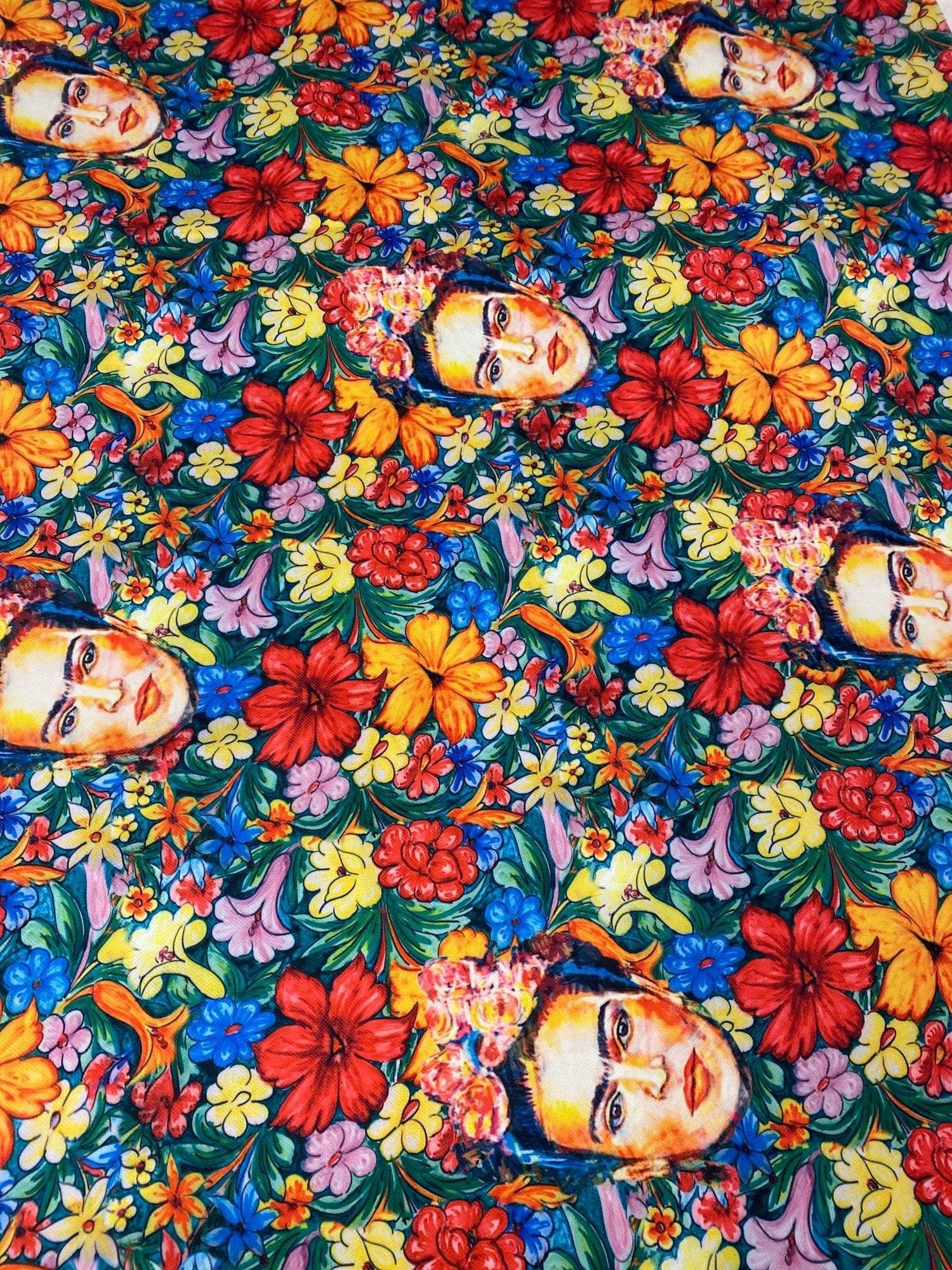 Frida Kahlo floral upholstery fabric with vibrant colorful flowers and artistic portrait pattern