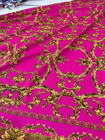 Fuchsia baroque fabric with intricate gold upholstery pattern and 150cm width
