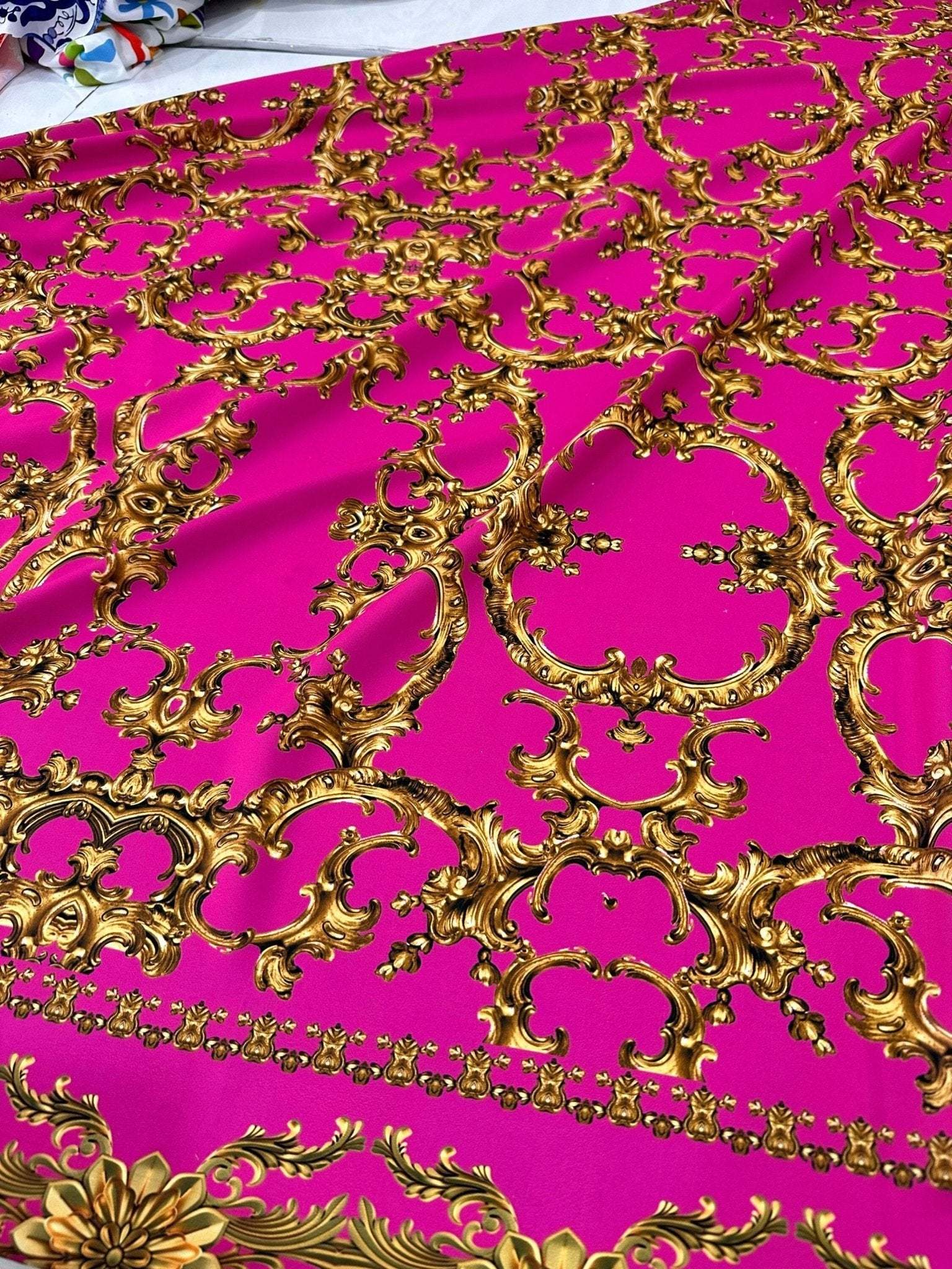 Fuchsia baroque fabric with intricate gold upholstery pattern and 150cm width