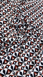 Black, red, and white geometric pattern fabric with modern abstract design, 150cm wide, ideal for sewing and crafts