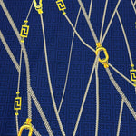 Navy blue Greek Key Pattern Fabric with white ropes and yellow gold clasps upholstery material