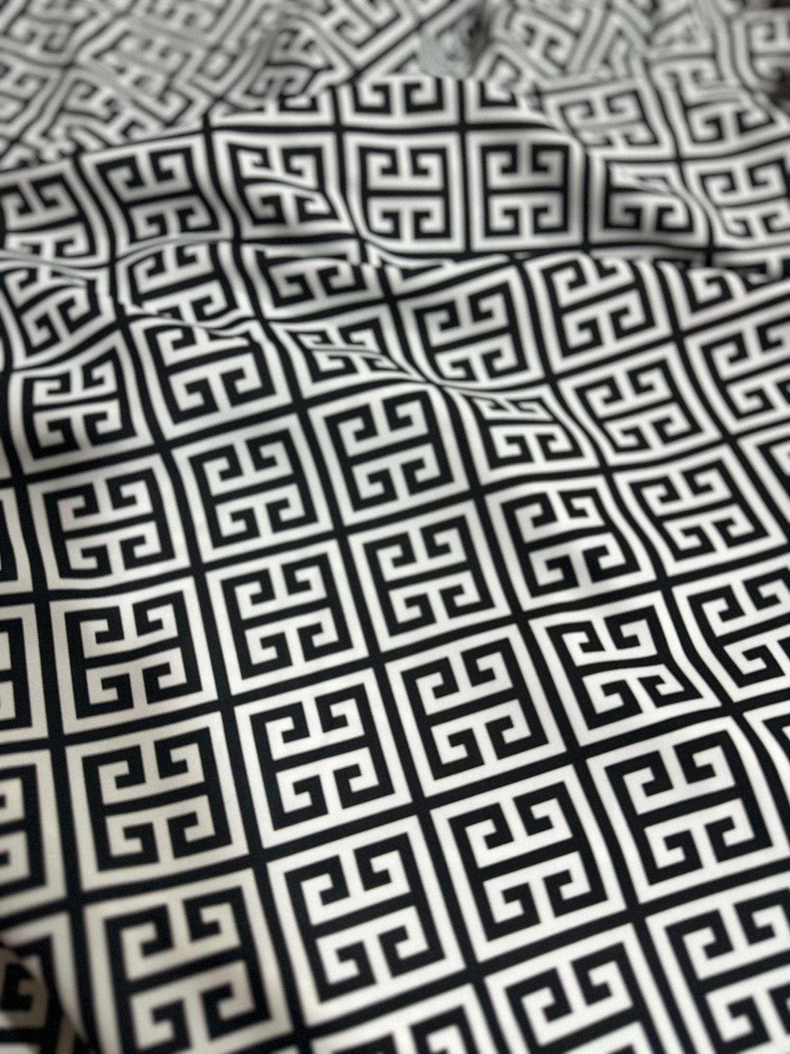 Close-up of black and white Greek Key Pattern Fabric with geometric design and 150cm width, suitable for upholstery and drapery projects