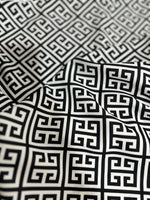 Close-up of black and white Greek Key Pattern Fabric with geometric design and soft texture