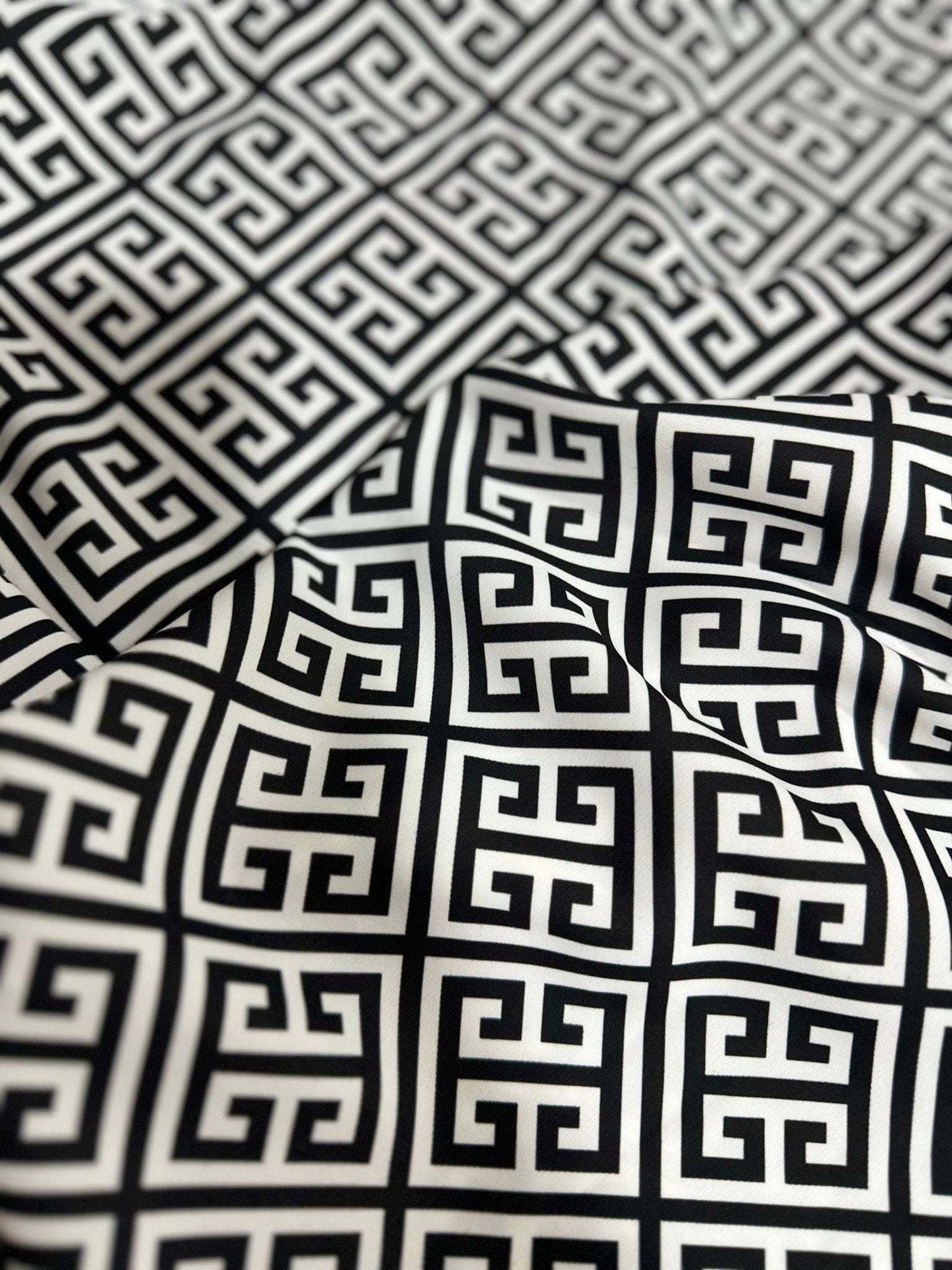 Close-up of black and white Greek Key Pattern Fabric with geometric design and soft texture
