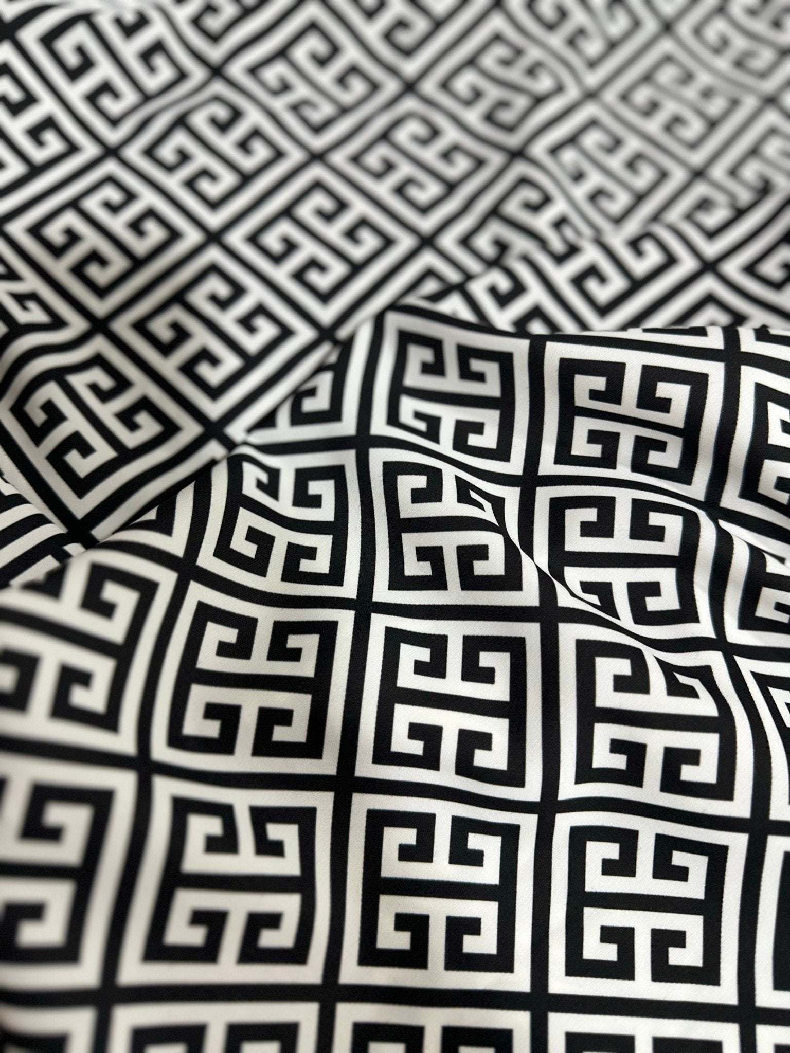 Close-up of black and white Greek Key Pattern Fabric with geometric design and soft texture