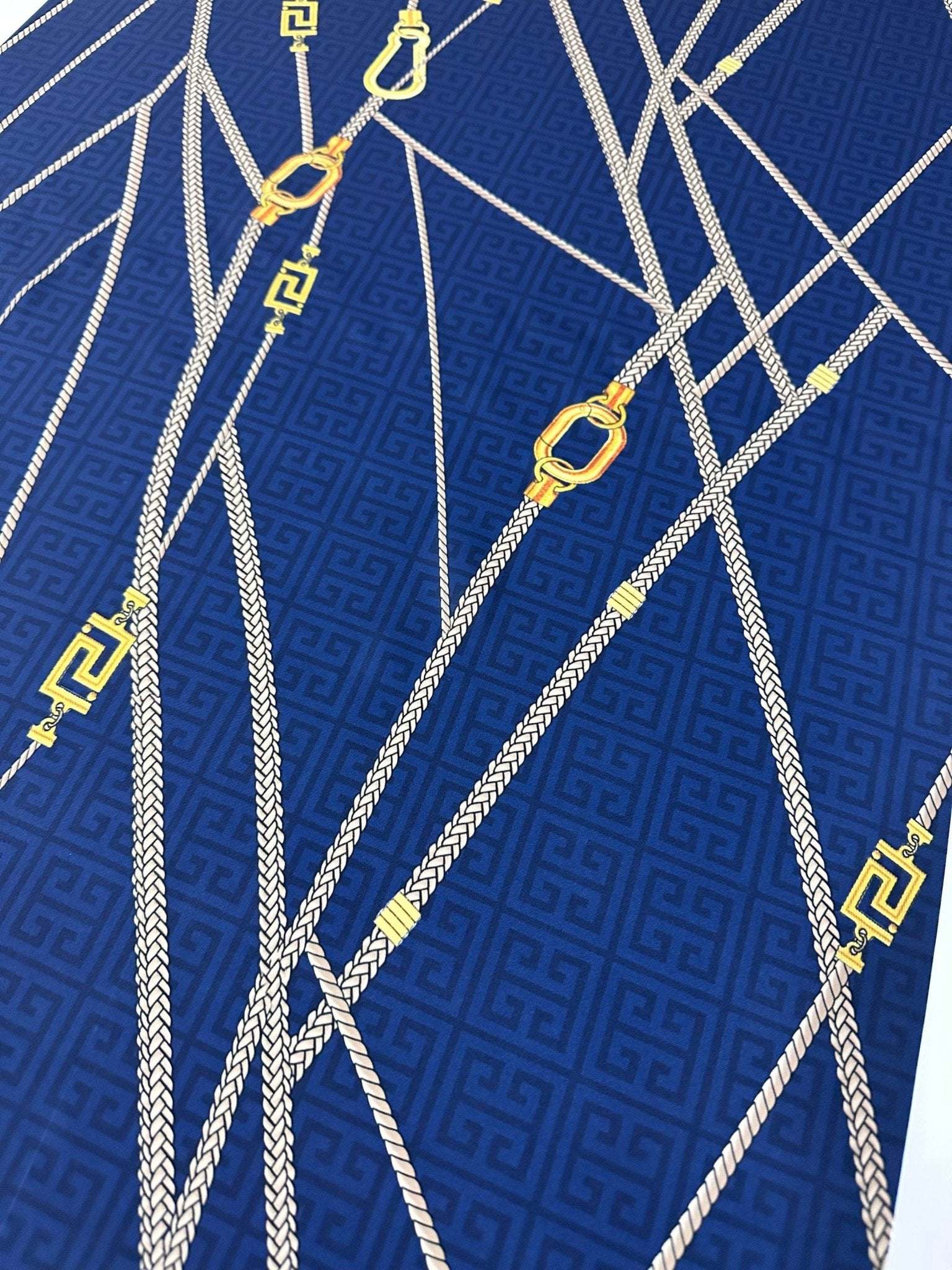 Navy blue fabric with Greek key pattern and gold chain design, 150cm width