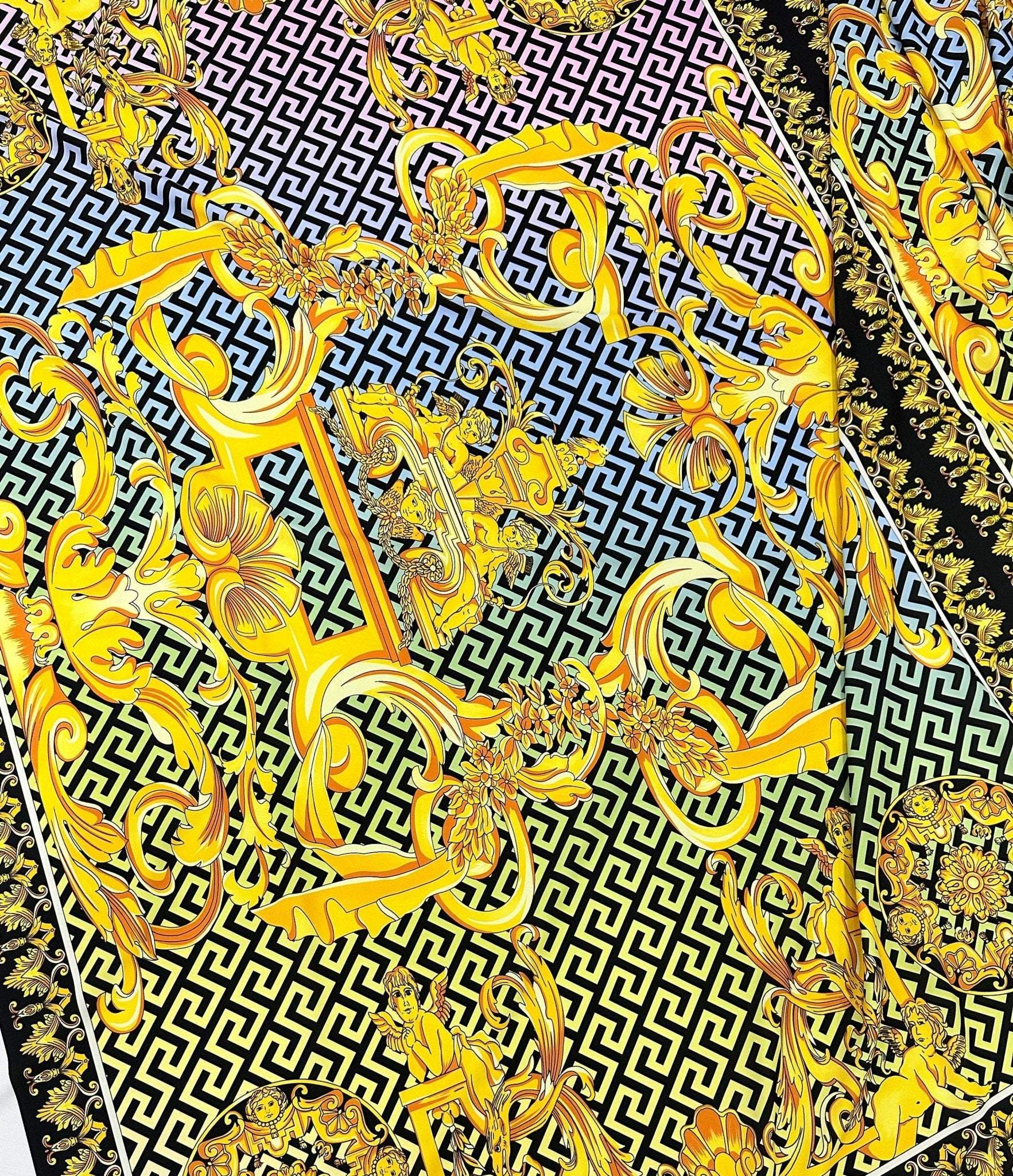 Gold Baroque Greek key pattern fabric in silky crepe with ornate gold designs on black and white geometric background