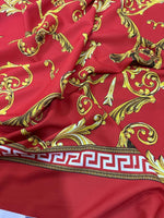 Red fabric with intricate gold Baroque and Greek key pattern, 150cm wide, ideal for sewing and upholstery projects