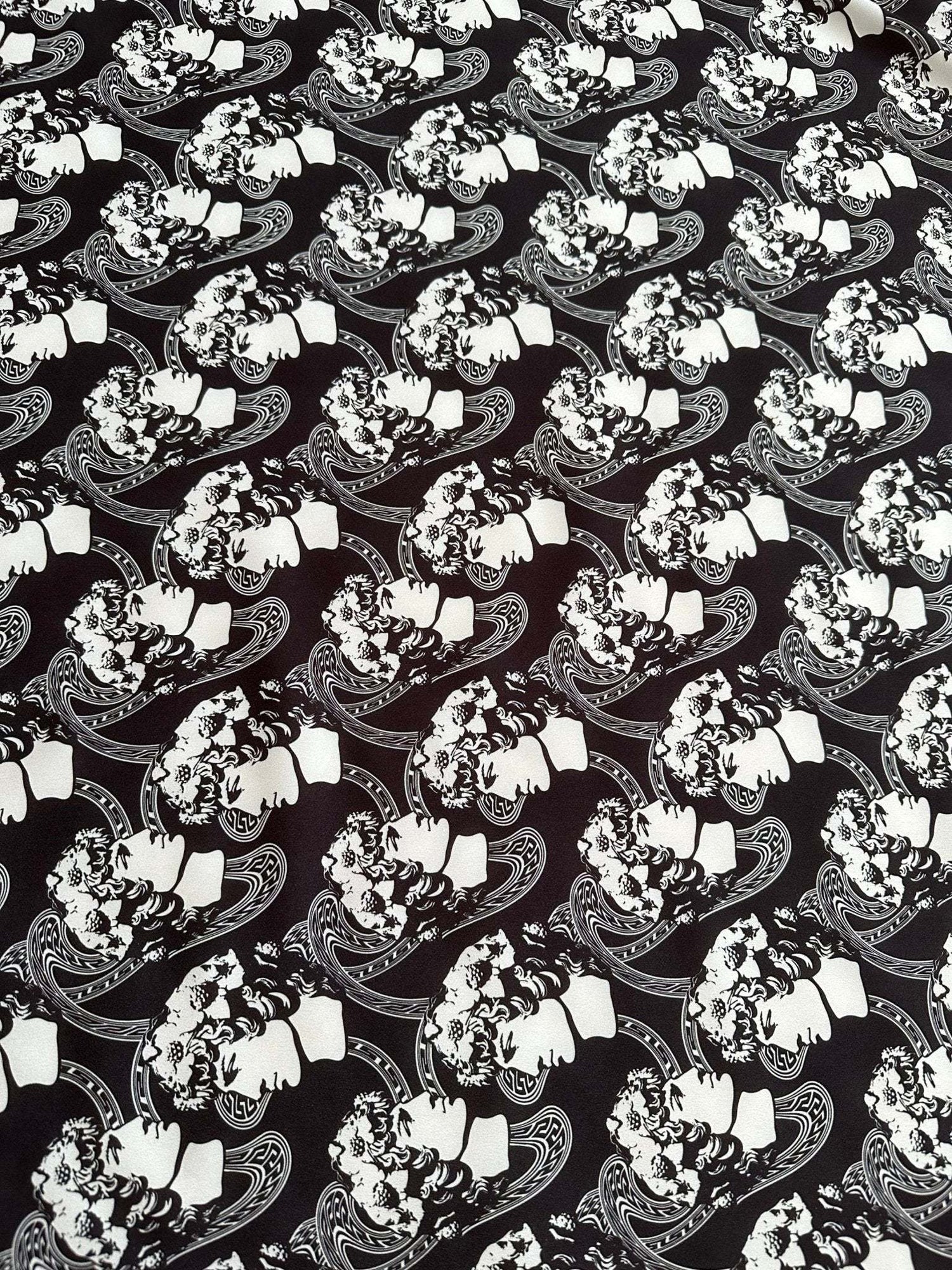 Black and white Greek crepe fabric with youth pattern featuring Rome design motifs