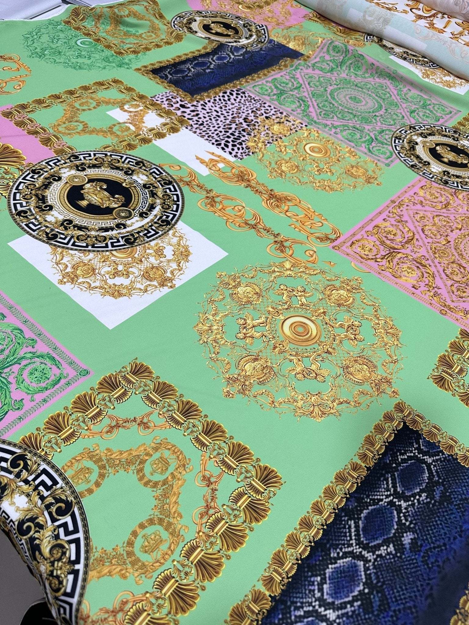 Green Baroque Crepe Fabric with ornate gold and floral patterns on green background