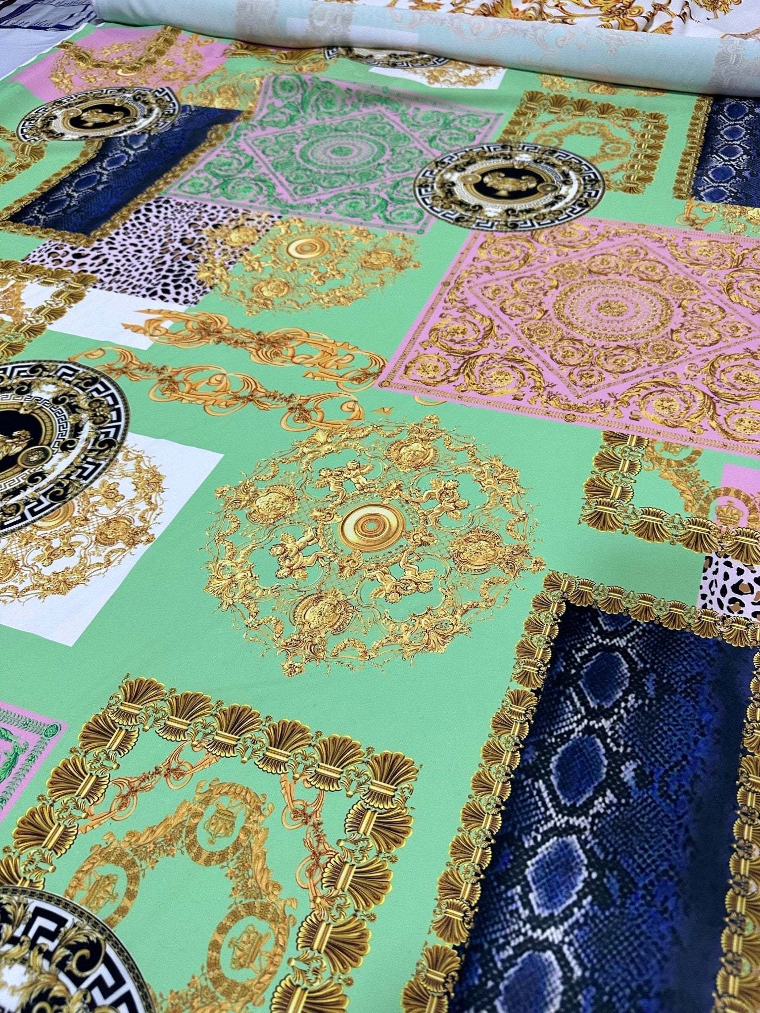 Green Baroque Crepe Fabric with ornate floral and geometric patterns on a mint green background