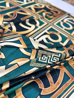Green Gold Crepe silky fabric with Greek key pattern and smooth texture