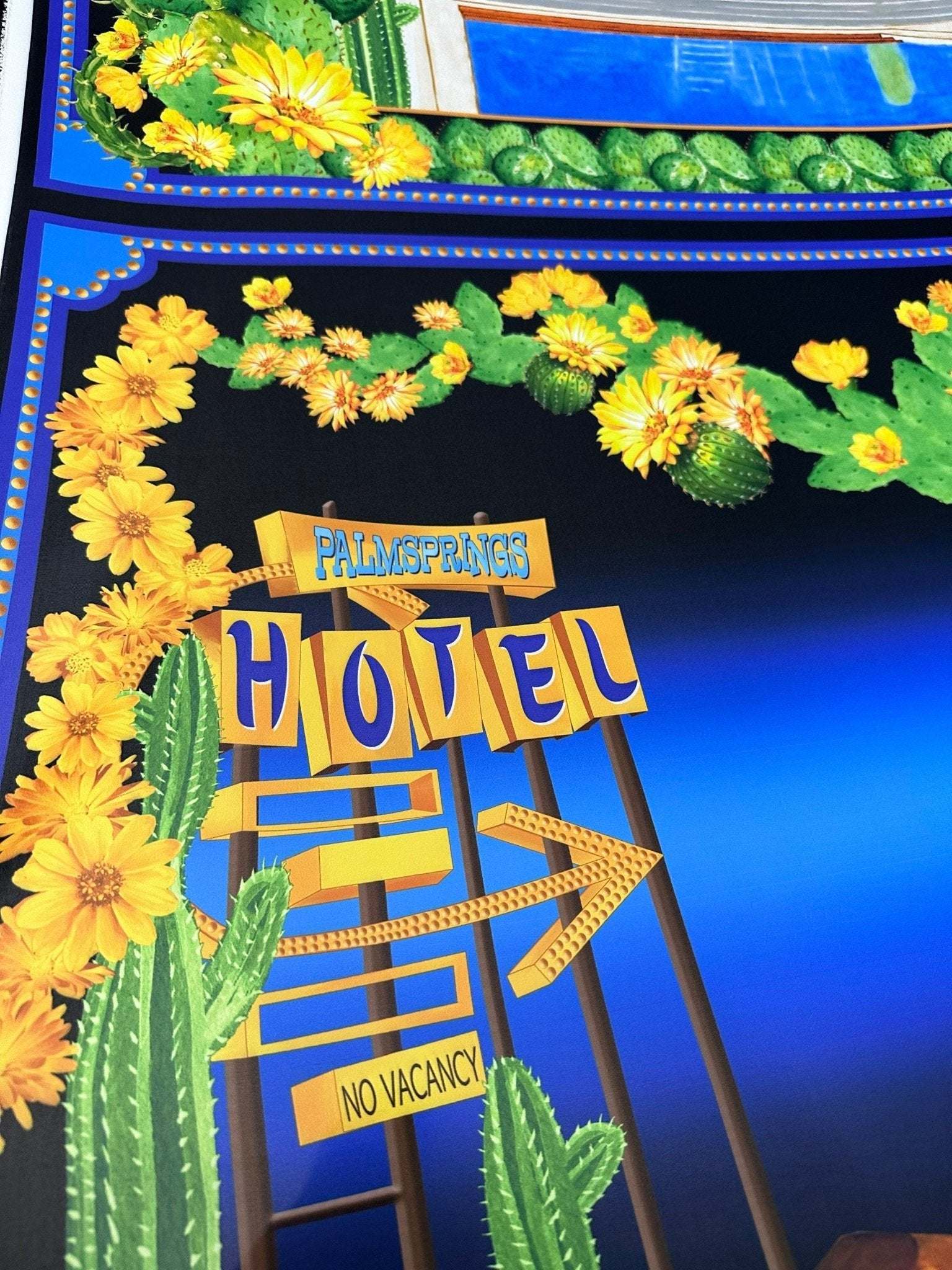 Palm Springs Retro Hotel Print Fabric with vibrant vintage hotel sign, yellow flowers, and cacti on blue background