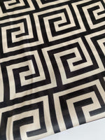 Close-up of black and white Greek Key Design Fabric with geometric pattern on 150cm wide textile material