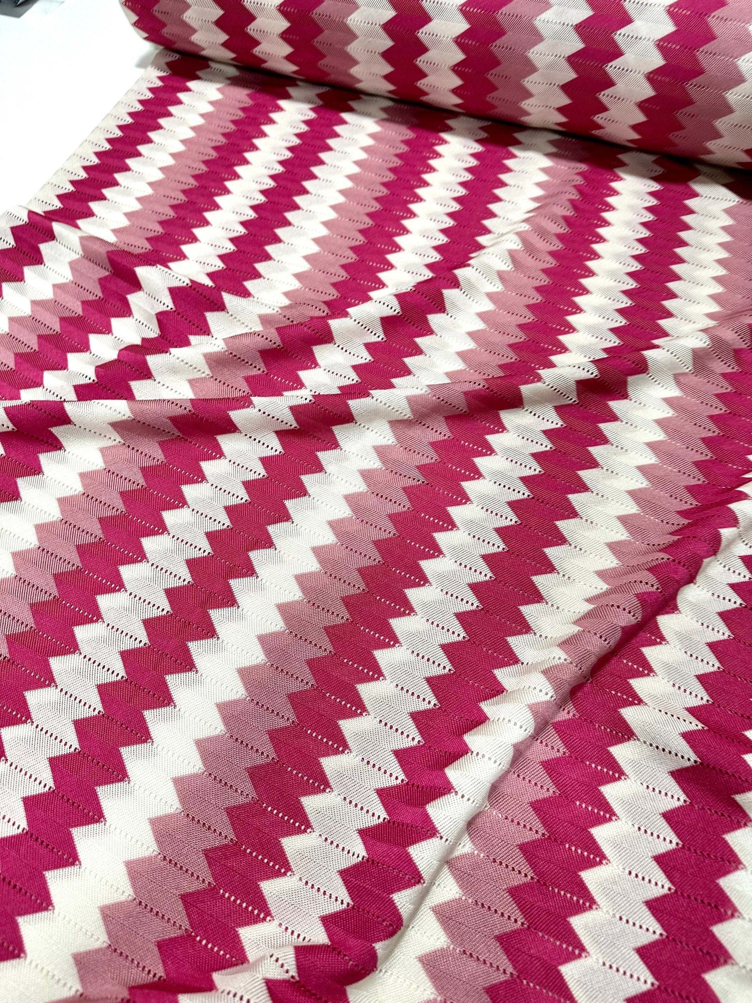 Luxury pink and white zigzag knit jersey fabric with soft chevron pattern and 150 cm width for fashion projects