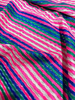 Pink striped knit jersey fabric with soft mesh texture and vibrant multicolor stripes