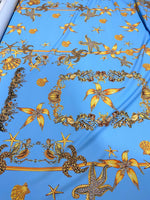 Blue fabric with yellow and brown sea shell and starfish pattern Sea Shell Pattern Fabric