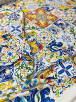 Luxury Majolica pattern fabric with vibrant blue, yellow, and green tile-inspired designs on smooth fabric by the yard