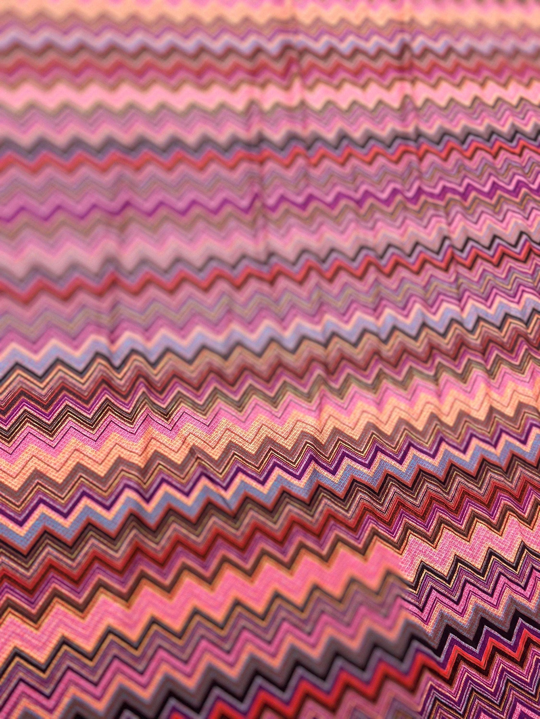 Close-up of colorful zigzag mesh stretch fabric with 4-way stretch and 150cm width