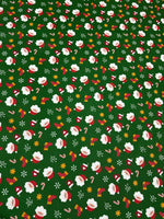 Green Santa Claus Christmas fabric with festive Santa and holiday icons on a green background