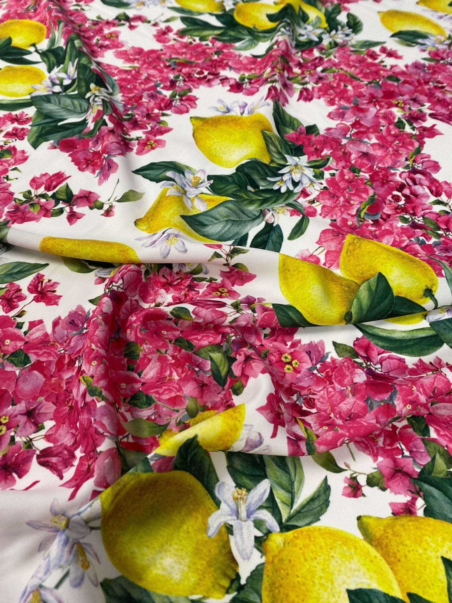 Lemon pink floral fabric with vibrant lemon and pink flower pattern on white background