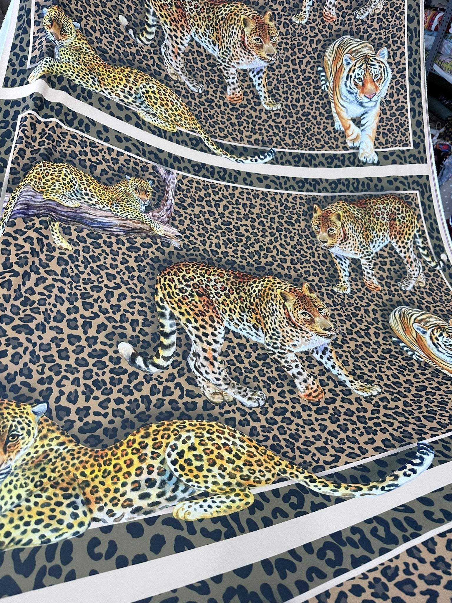 Leopard print crepe fabric with detailed big cat illustrations on a spotted background, 150cm wide textile for fashion projects