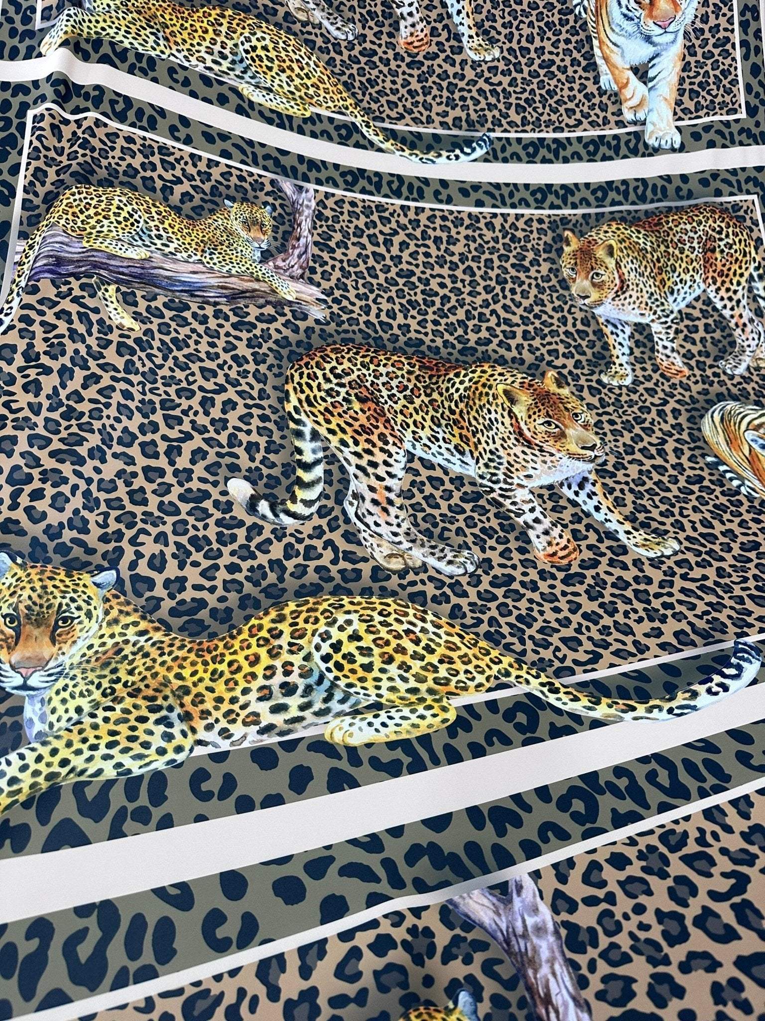 Leopard print crepe fabric with detailed big cat illustrations and soft drape, 150cm wide